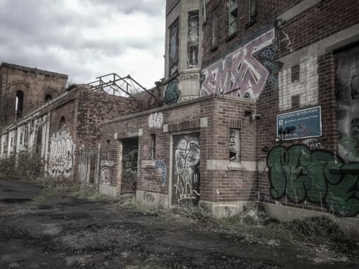Abandoned factory, a brick building covered in graffiti